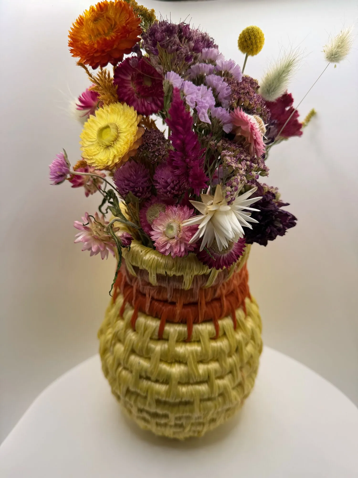Yellow and coral rope vase with dried flowers
